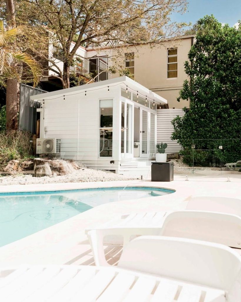 11. A Minimalist White Poolside Setup