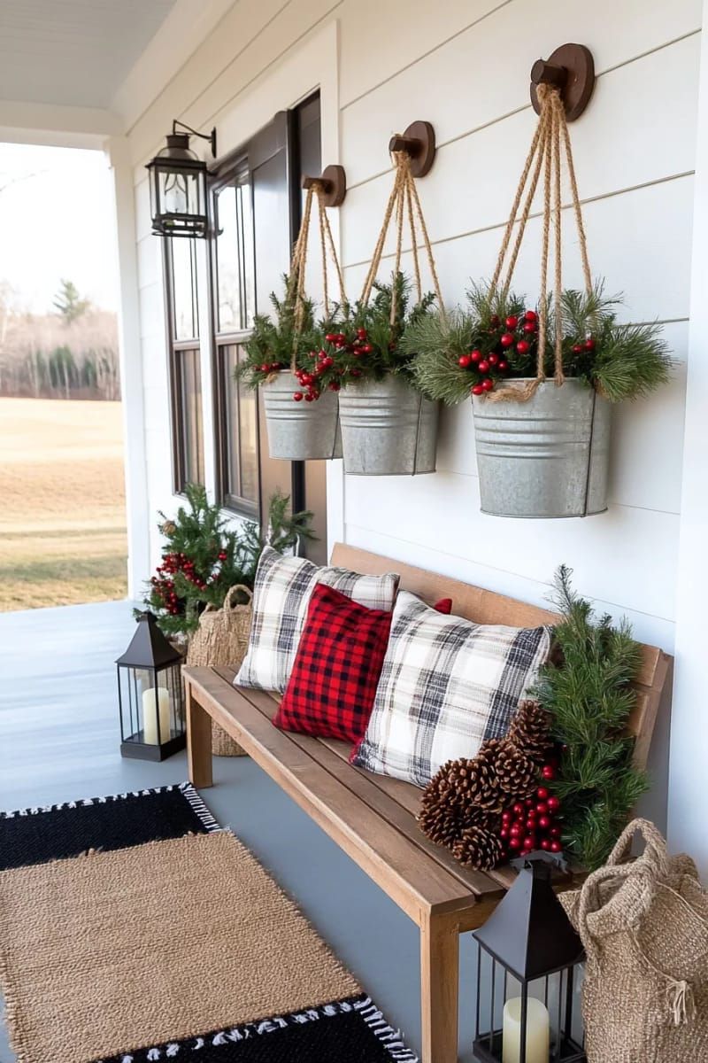 3. Hanging Galvanized Buckets with Greenery and Berries