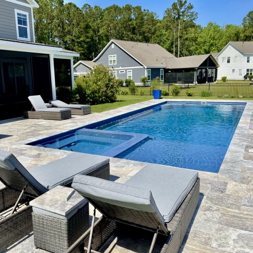 23. A Backyard Pool With Built-In Spa