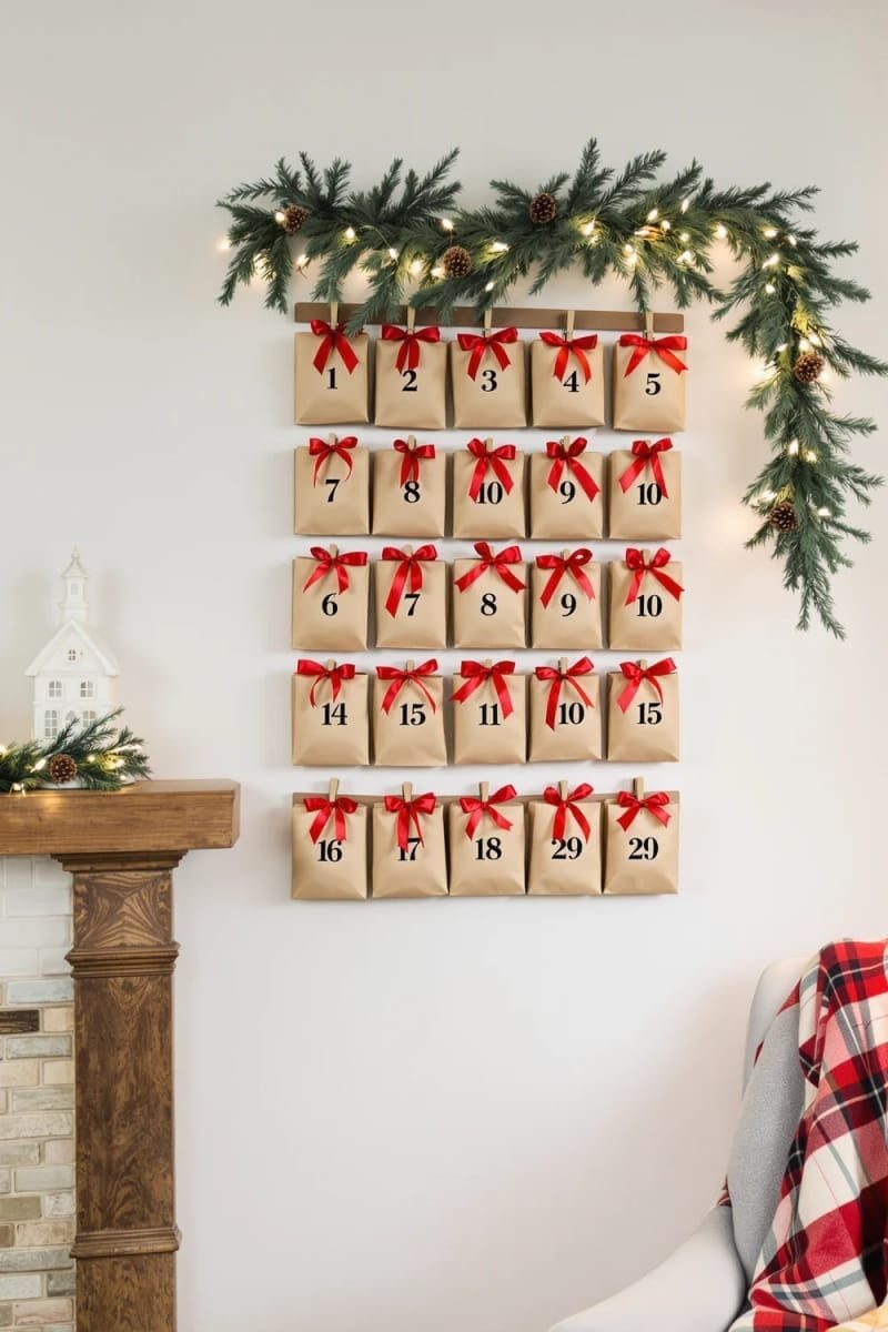 21. Handmade advent calendar featuring small numbered gift bags and red ribbons