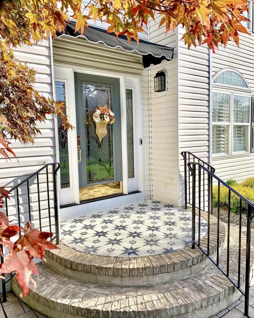5. Patterned Tile Steps by a Glass Door