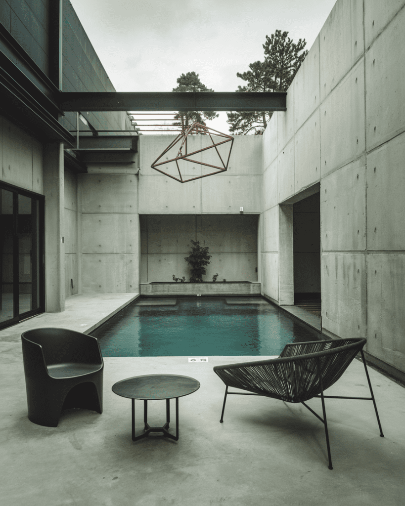 23. Industrial-Style Pool with Concrete and Steel Elements