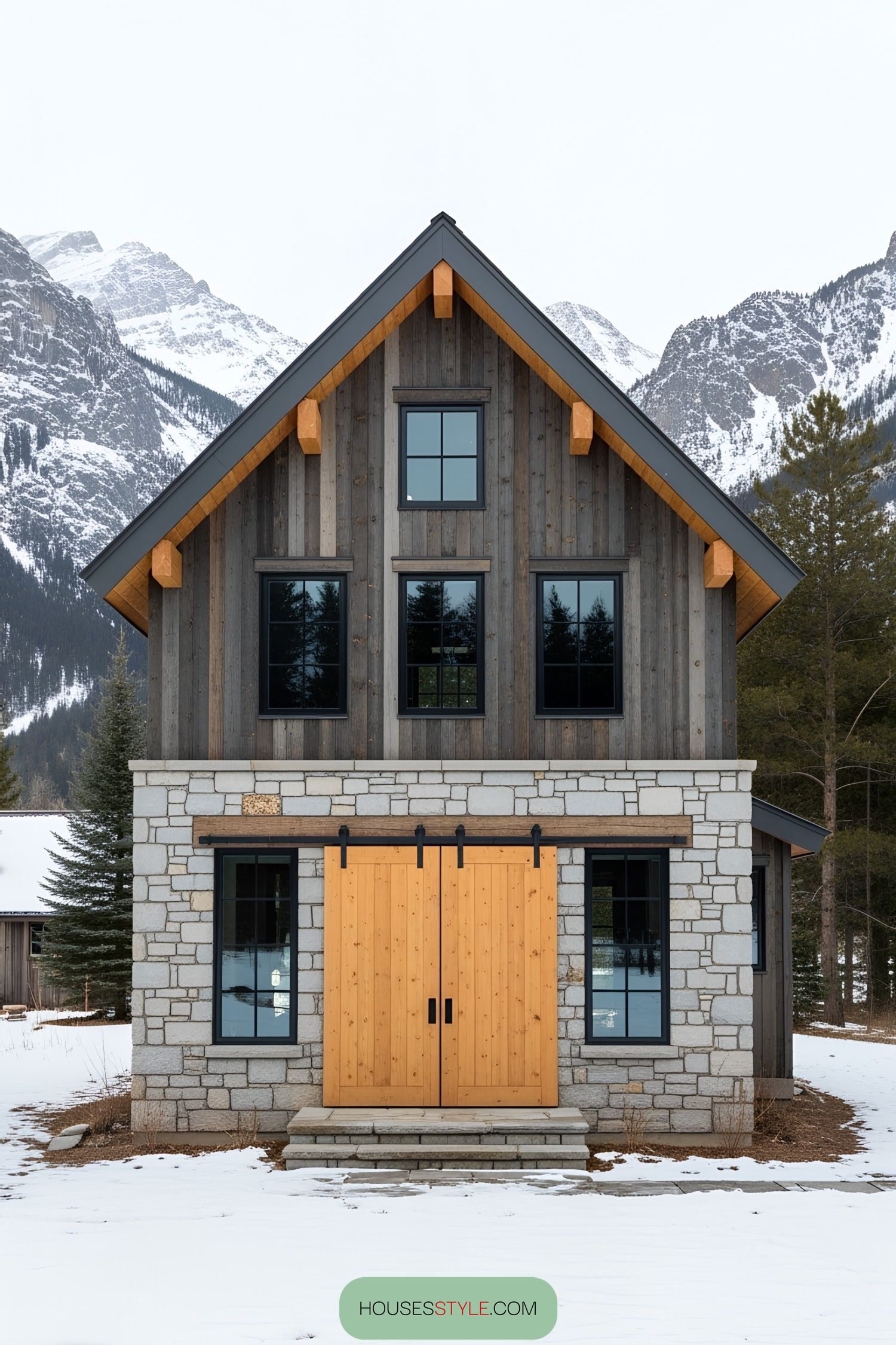 Rustic Charm Set Against Towering Mountain Peaks