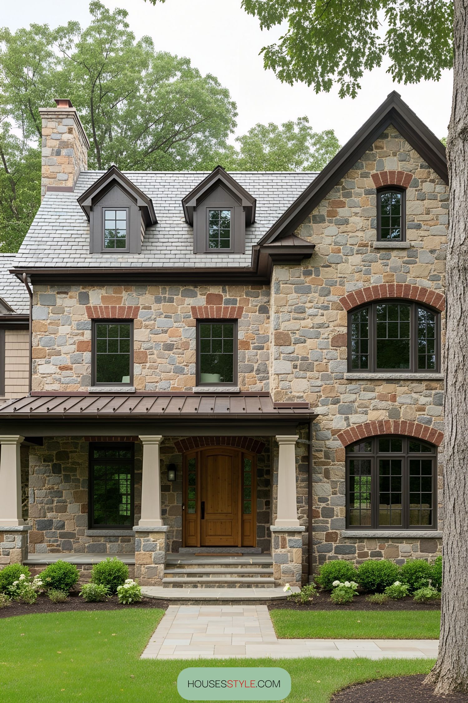 Stone Cottage Tucked Among Green Trees
