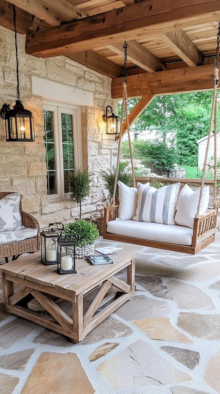 22. Barnyard-Style Patio with a Swinging Chair