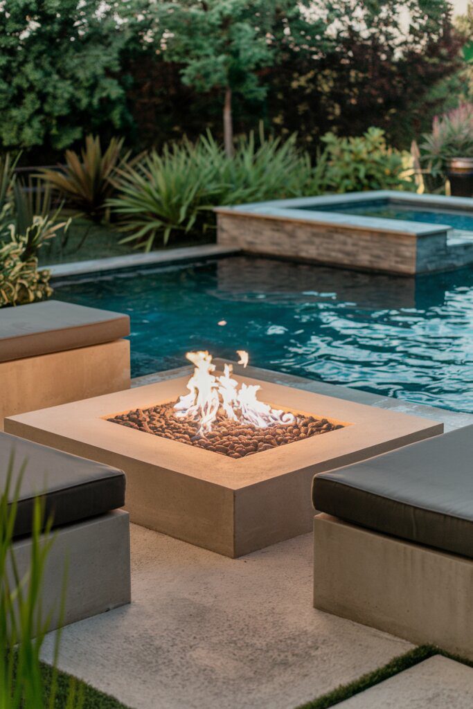 20. Relax by the Pool in the Cozy Sunken Fire Pit Lounge