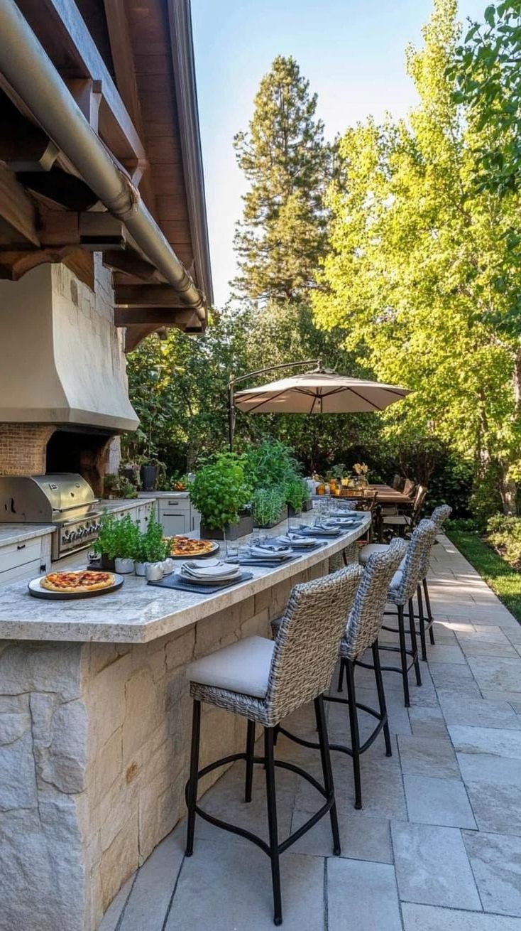 32. Outdoor Patio Kitchen with a Pizza Oven