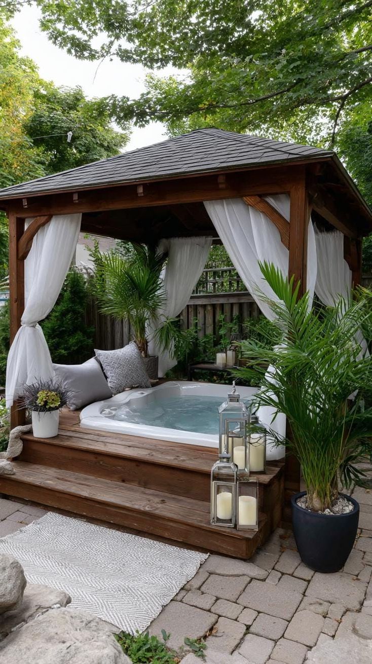 14. Relax in a hot tub under a cozy gazebo with beautiful sheer curtains.