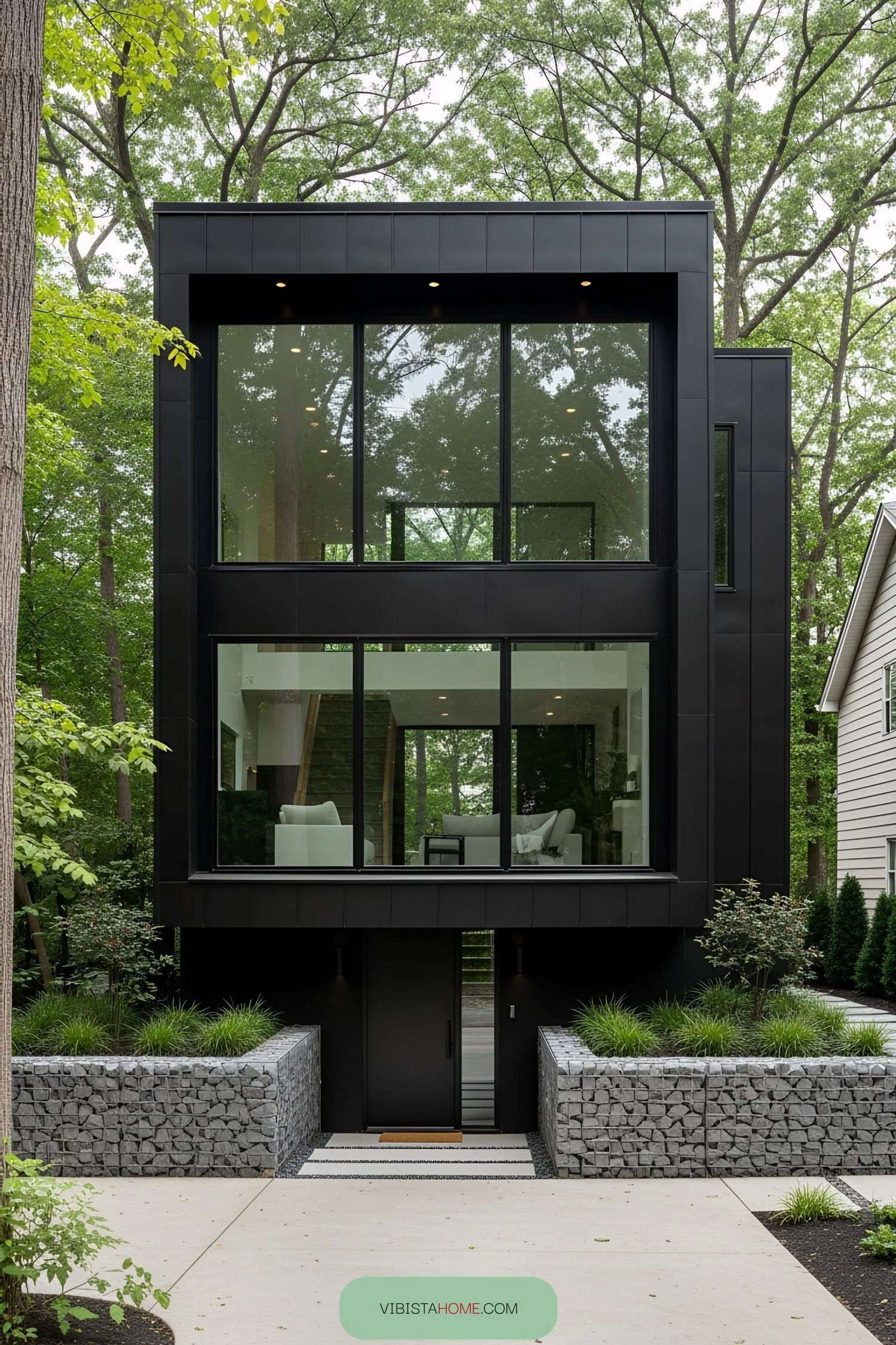 A Modern Black Box Tucked Among Trees
