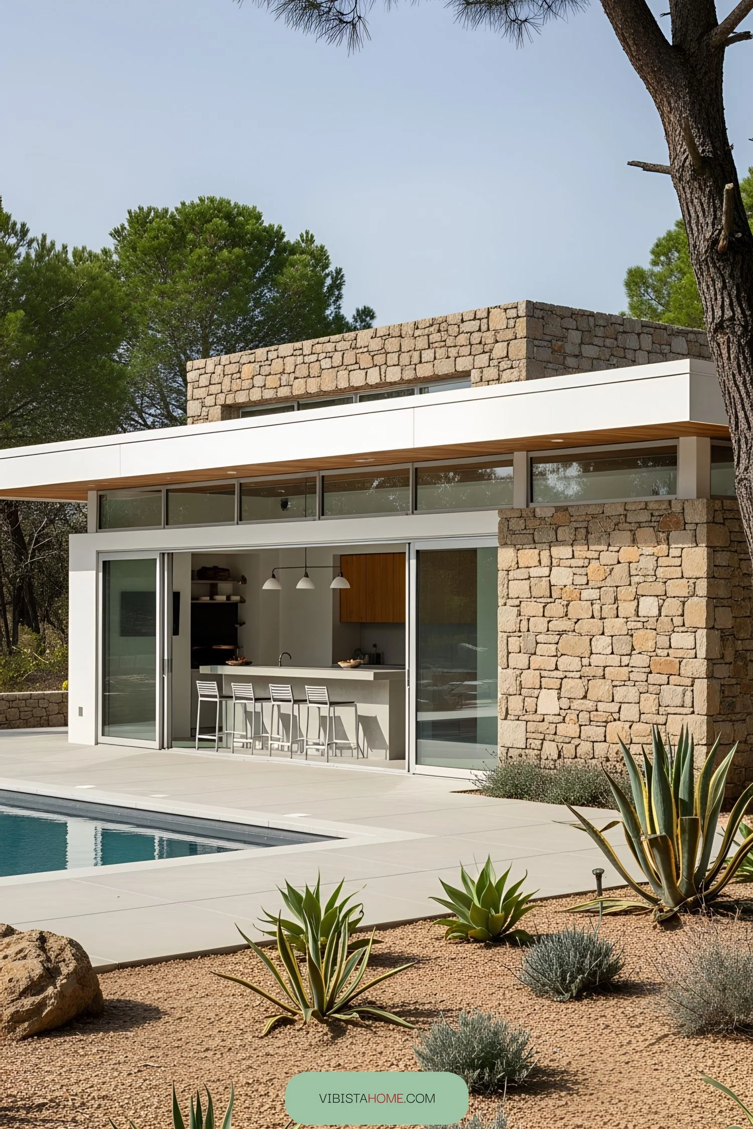 A Magical Poolside Oasis of Stone and Light
