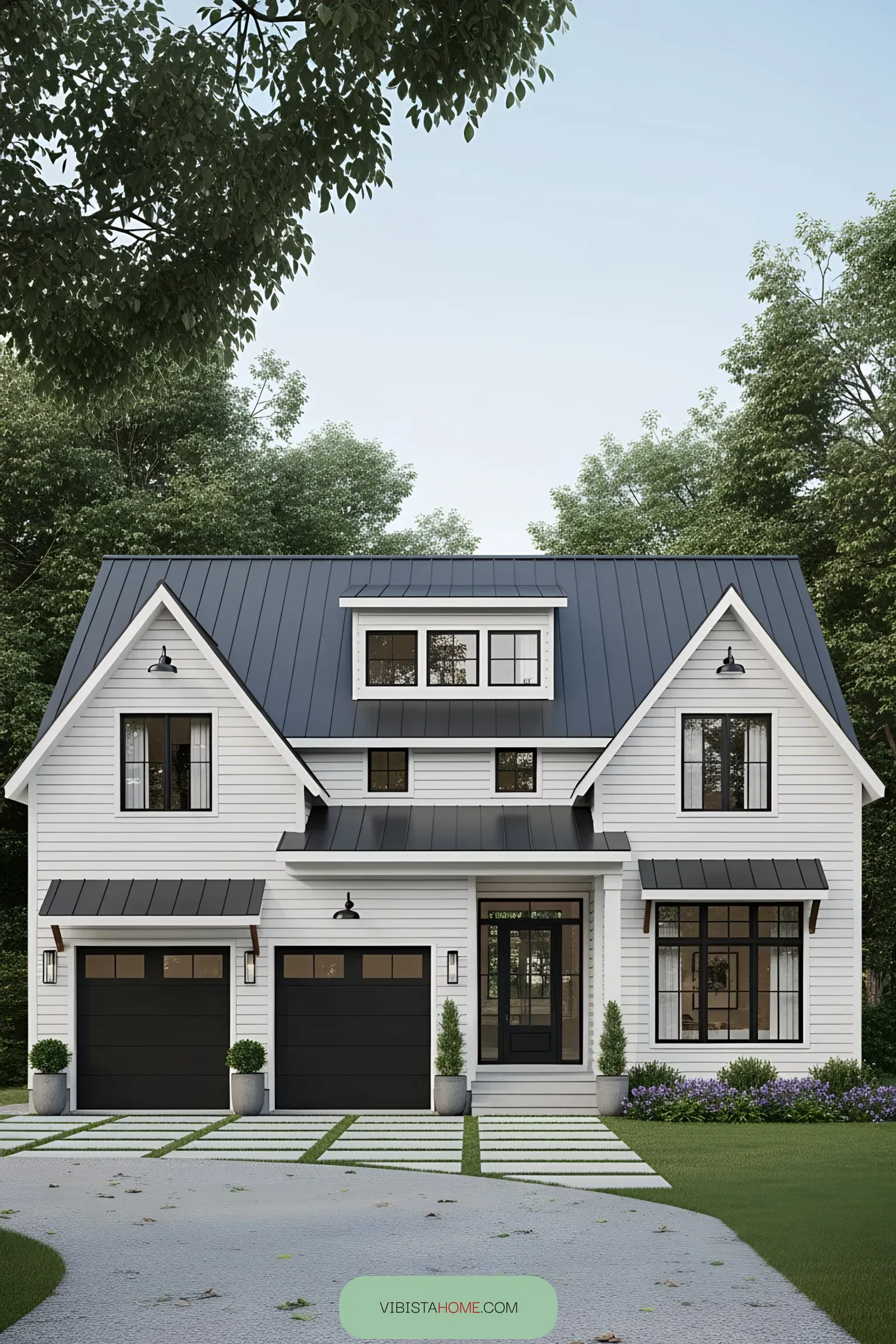 White Farmhouse with Statement Garage Doors